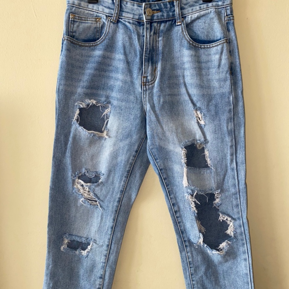 light wash extreme distressed boyfriend jeans